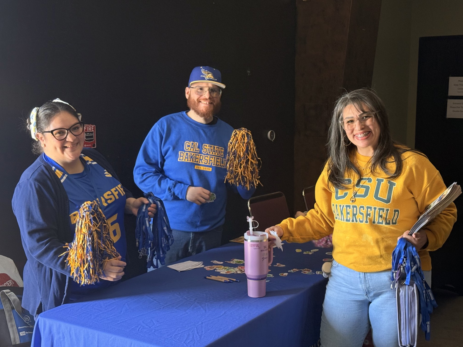 Eva and JR Perez hosting an Outreach Table