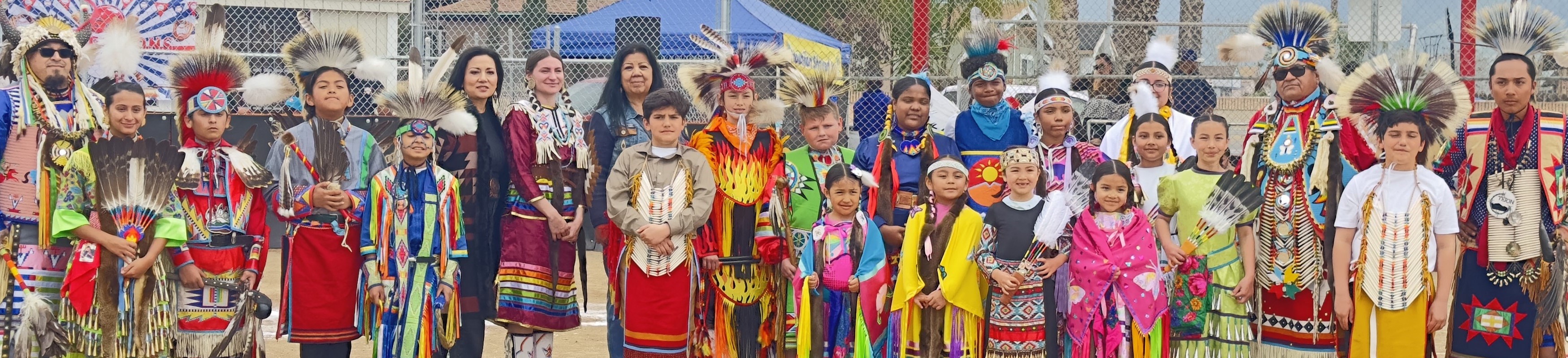 Wide Angle Photo of Tejon Indian Tribal Members in Pow-Wow Regalia. 