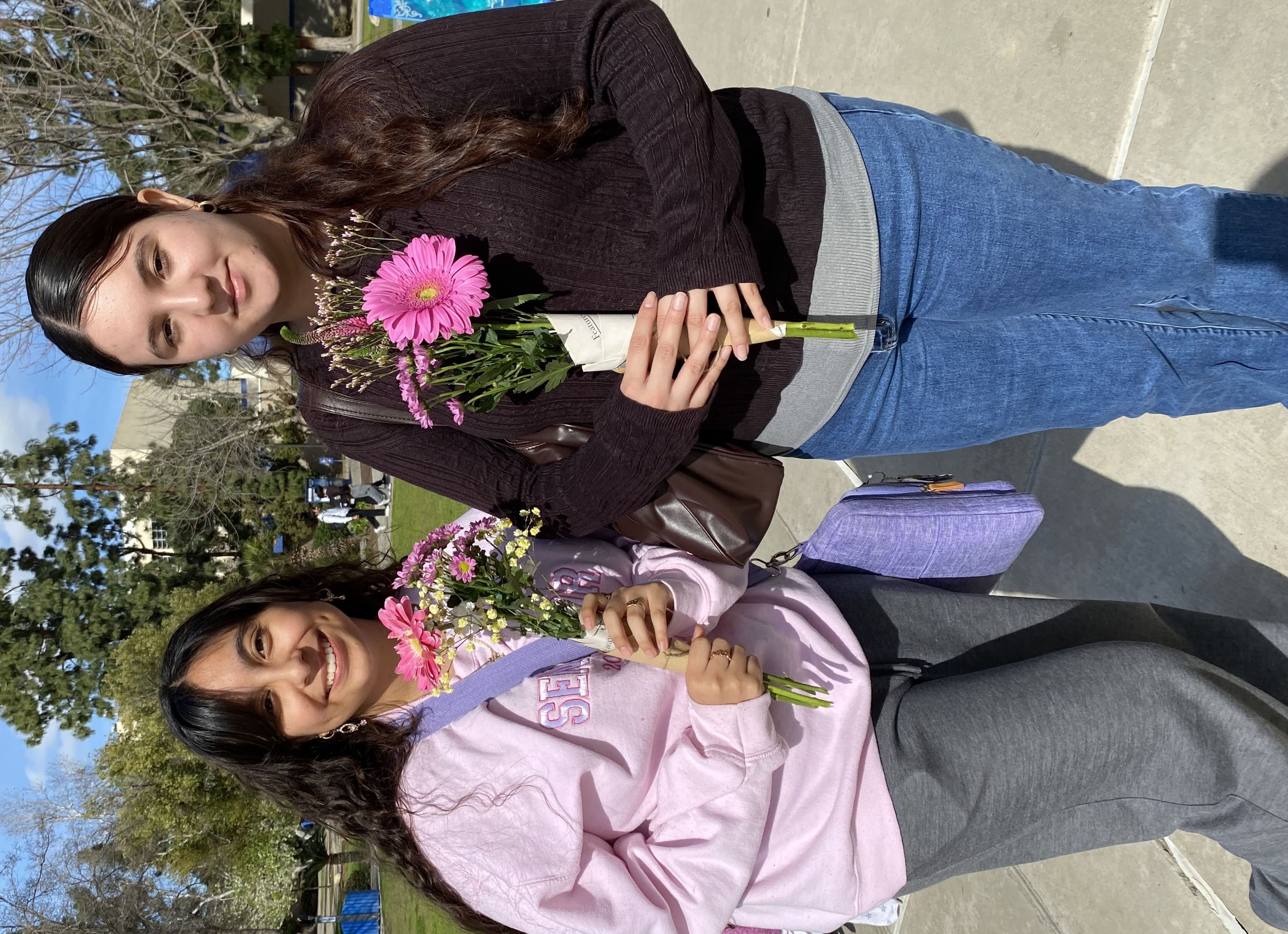 Two Woman Holding Flower